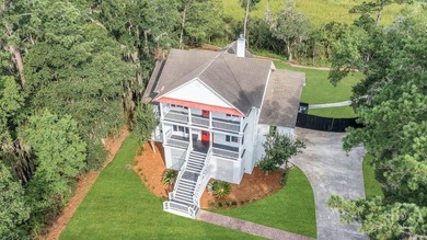 Situated on over an acre of beautifully landscaped marshfront - photo 7