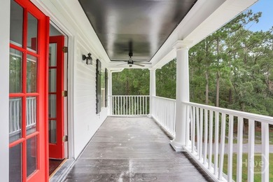 Situated on over an acre of beautifully landscaped marshfront - photo 8