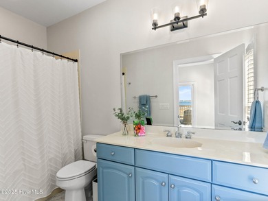 Welcome to this exquisite custom-built soundfront home in