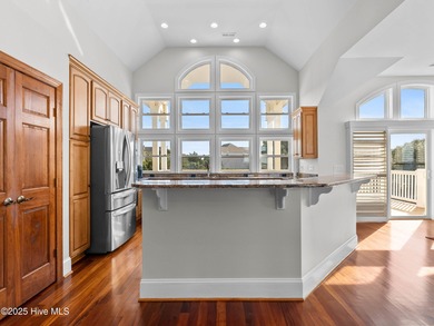 Welcome to this exquisite custom-built soundfront home in