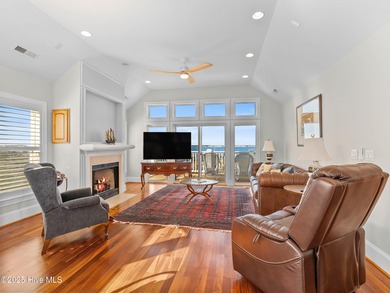 Welcome to this exquisite custom-built soundfront home in