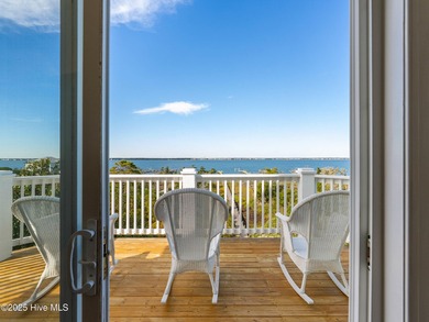 Welcome to this exquisite custom-built soundfront home in