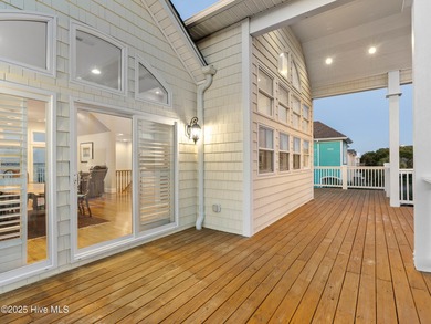 Welcome to this exquisite custom-built soundfront home in