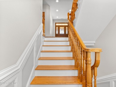 Welcome to this exquisite custom-built soundfront home in