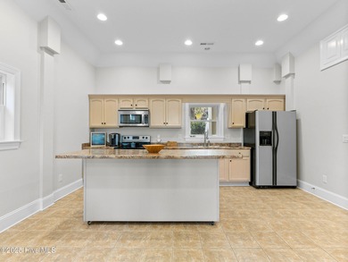 Welcome to this exquisite custom-built soundfront home in