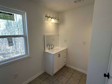 This cozy retreat features one bedroom, one bath, and a - photo 11