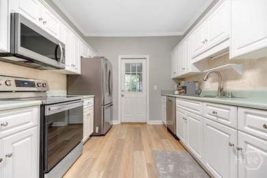 This updated townhome has new LVP flooring throughout and new - photo 8