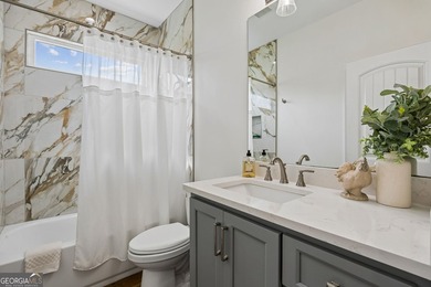 SHOWING LIKE A MODEL HOME, this exceptional custom-built - photo 34