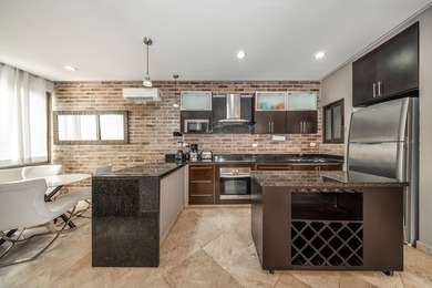 This spacious one-bedroom condominium is perfectly located in