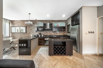 This spacious one-bedroom condominium is perfectly located in