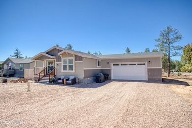 Built in 2023, this well-maintained Cavco home is situated on a - photo 1