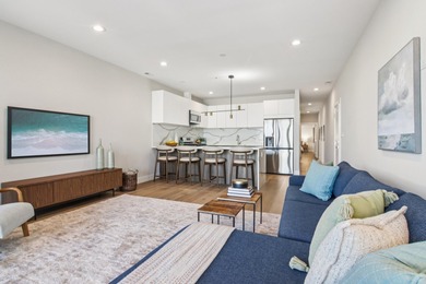 Welcome to refined urban living in this sun-drenched north/east