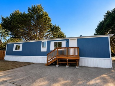 This is a charming, move-in-ready mobile home located in a - photo 1