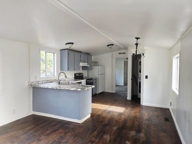 This is a charming, move-in-ready mobile home located in a - photo 4