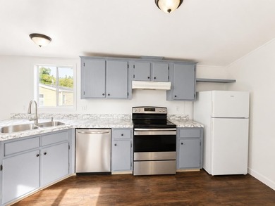 This is a charming, move-in-ready mobile home located in a - photo 5