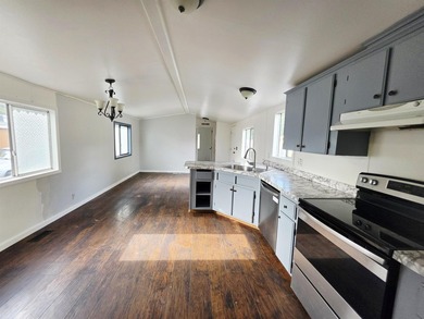 This is a charming, move-in-ready mobile home located in a - photo 6