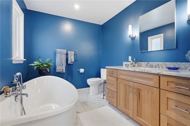 This beautifully updated 4-bedroom, 3.5-bath ranch sits on