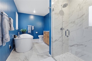 This beautifully updated 4-bedroom, 3.5-bath ranch sits on