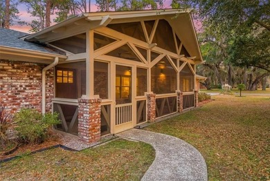 Set beneath a quiet canopy of live oaks, 636 Old Plantation Road - photo 1