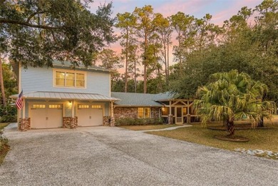 Set beneath a quiet canopy of live oaks, 636 Old Plantation Road - photo 2