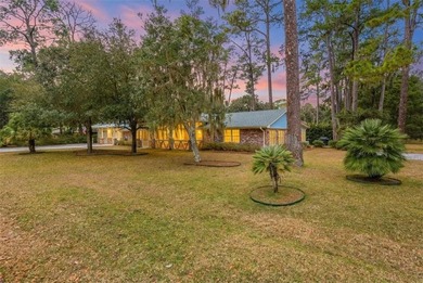 Set beneath a quiet canopy of live oaks, 636 Old Plantation Road - photo 3
