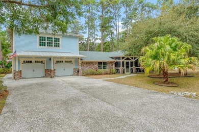 Set beneath a quiet canopy of live oaks, 636 Old Plantation Road - photo 7