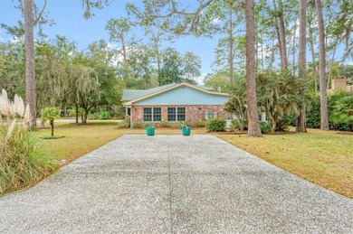 Set beneath a quiet canopy of live oaks, 636 Old Plantation Road - photo 8