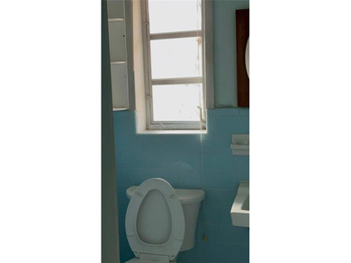 Looking for a large brick home? This one needs lots of TLC but - photo 10