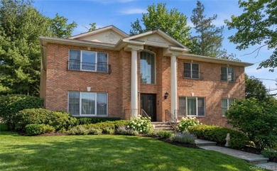 FLOWER HILL, ROSLYN | BRICK CENTER HALL COLONIAL. Located on a - photo 2