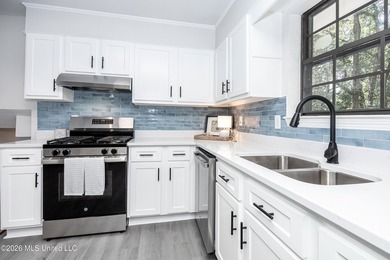Stunning newly renovated white brick home in DOWNTOWN GOLF CART - photo 17