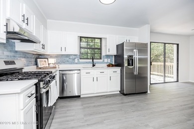 Stunning newly renovated white brick home in DOWNTOWN GOLF CART - photo 18