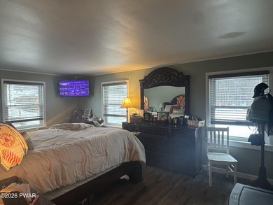 This contemporary 4-bedroom, 2-bath home blends clean modern