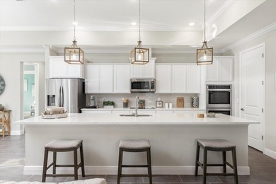 Former Model Home - Situated in Elegant Manor Estates, you will - photo 7