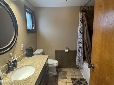 This contemporary 4-bedroom, 2-bath home blends clean modern