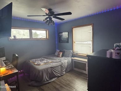 This contemporary 4-bedroom, 2-bath home blends clean modern