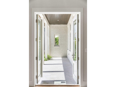 A showstopper of modern coastal elegance, 36 Sandcord Drive is a - photo 11