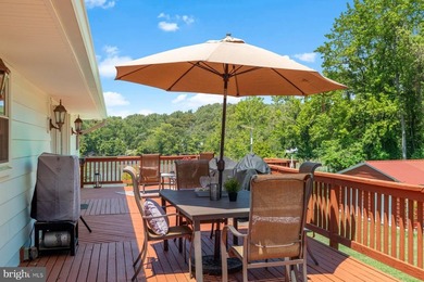 Nestled at the end of a peaceful peninsula in the sought-after - photo 17