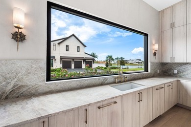 A showstopper of modern coastal elegance, 36 Sandcord Drive is a - photo 21