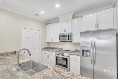 Newly constructed in 2024, this modern 3BR/2.5BA home offers an - photo 7