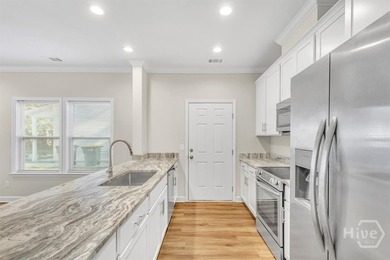 Newly constructed in 2024, this modern 3BR/2.5BA home offers an - photo 8