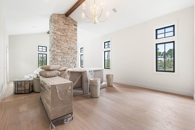 A showstopper of modern coastal elegance, 36 Sandcord Drive is a - photo 33