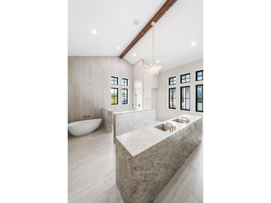 A showstopper of modern coastal elegance, 36 Sandcord Drive is a - photo 50