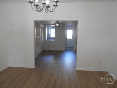 The 2-story brick townhome is located in a residential - photo 6