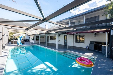 Come experience this impressive 6-bedroom, 5-bath residence with - photo 3