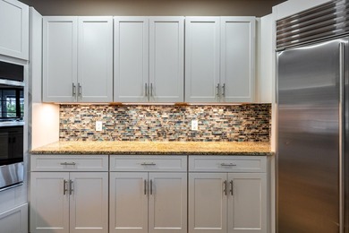Come experience this impressive 6-bedroom, 5-bath residence with - photo 10
