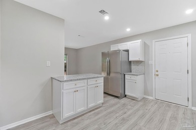 Completely renovated and move-in ready. This home features a - photo 12