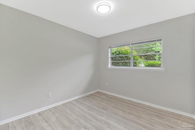 Completely renovated and move-in ready. This home features a - photo 22