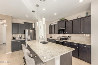 Resort-style 55+ living in Sun City Festival! This upgraded