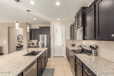 Resort-style 55+ living in Sun City Festival! This upgraded