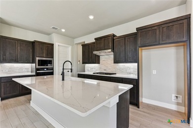 Auburn Plan with upgraded kitchen, quartz countertops, dry bar - photo 11